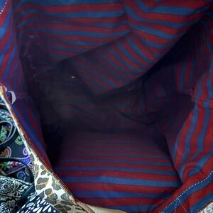 Authentic Tory burch tote reversible stripe with leopard good condition